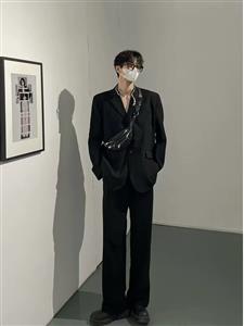 Small black suit jacket with shoulder pads